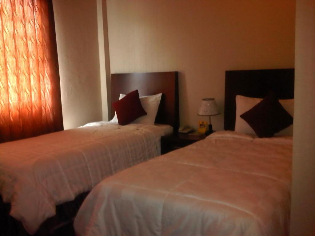 Grand Duta Hotel Palu Cameră foto