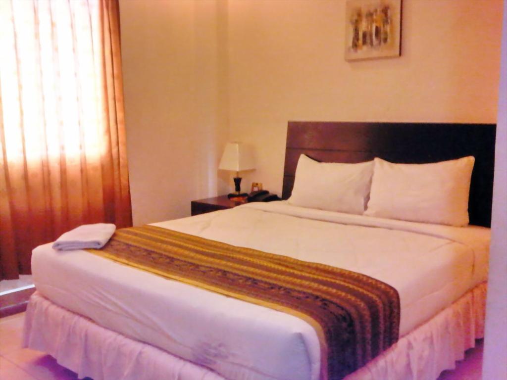 Grand Duta Hotel Palu Cameră foto
